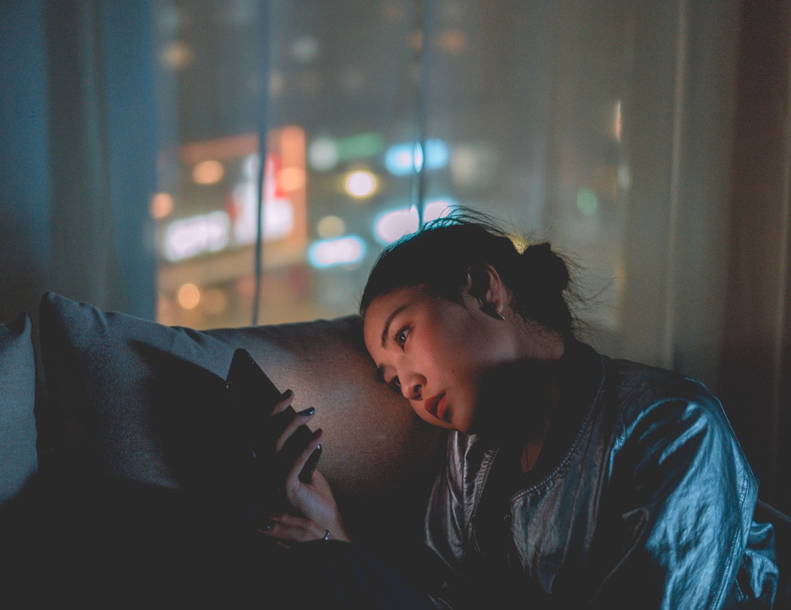 Homeowner on her phone late at night